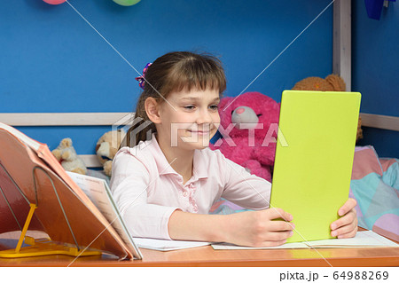 The girl has done homework and communicates with The girl has done homework and communicates with 64988269