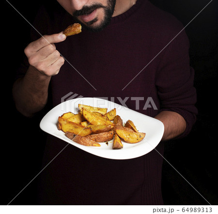 homemade french fries with dark background homemade french fries with dark background 64989313
