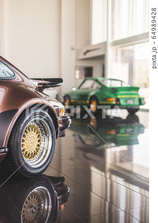 Red and green design supercar in the showroom 64989428