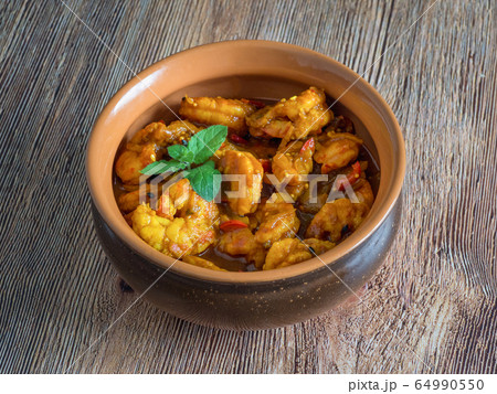 King Prawn Masala in a clay bowl. 64990550