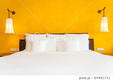 White pillow on bed decoration interior of bedroom White pillow on bed decoration interior of bedroom 64992731