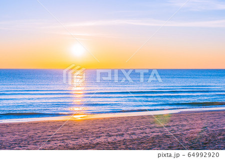 Beautiful tropical nature beach sea ocean at sunset or sunrise 64992920