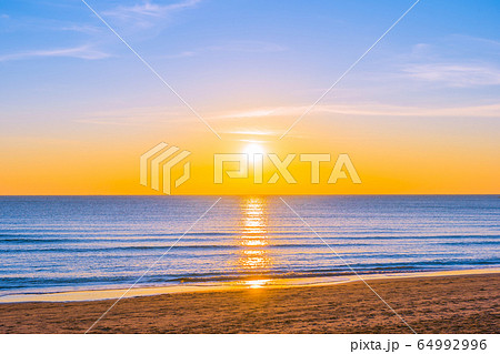 Beautiful tropical nature beach sea ocean at sunset or sunrise Beautiful tropical nature beach sea ocean at sunset or sunrise 64992996
