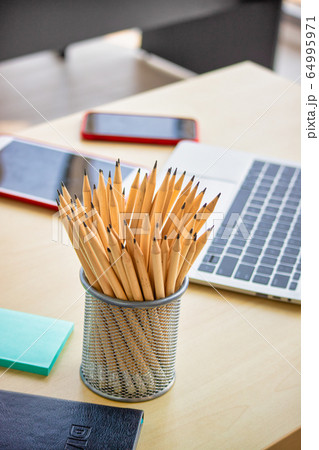 Numerous pencils that have been sharpened in an 64995971