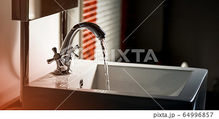 Faucet and water flow on bathroom Faucet and water flow on bathroom 64996857