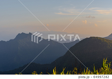High angle viewpoint sunset over mountains and High angle viewpoint sunset over mountains and 64997282