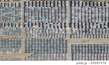 Aerial view Lot of vehicles on parking for new car Aerial view Lot of vehicles on parking for new car 64997478