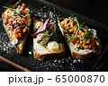Delicious Italian bruschetta with tomato, meat pate, olives, cream cheese. Set of tasty appetizer sandwiches. 65000870
