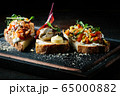 Delicious Italian bruschetta with tomato, meat pate, olives, cream cheese. Set of tasty appetizer sandwiches. 65000882