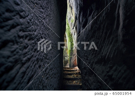 Narrow path in the middle rock formations 65001954