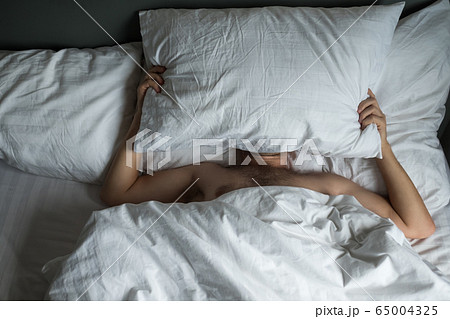 Caucasian man suffering from insomnia 65004325