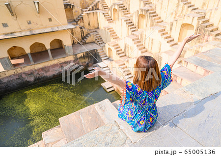 Portrait of young woman in Panna Meena ka Kund step-well 65005136
