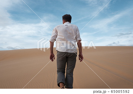 Caucasian young man going straight on his way on 65005592