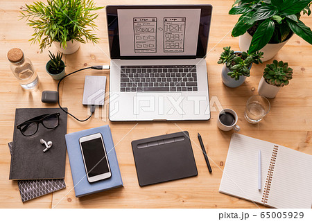 Flatlay of workplace of architect or designer with gadgets and other stuff Flatlay of workplace of architect or designer with gadgets and other stuff 65005929
