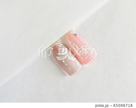 Delicate pink summer manicure with monograms. Delicate pink summer manicure with monograms. 65006718