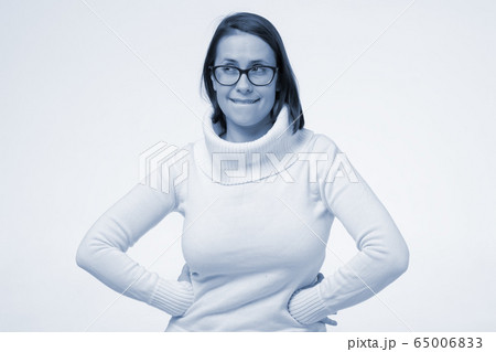 Cunning beautiful woman looking aside indenting to 65006833