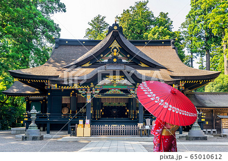 Woman wearing japanese traditional kimono with umbrella at katori shrine in Chiba, Japan. 65010612