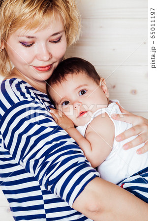 mom hugs his little daughter girl love family 65011197
