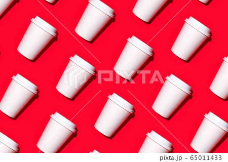 Pattern of disposable coffee cups on a red background. Pattern of disposable coffee cups on a red background. 65011433