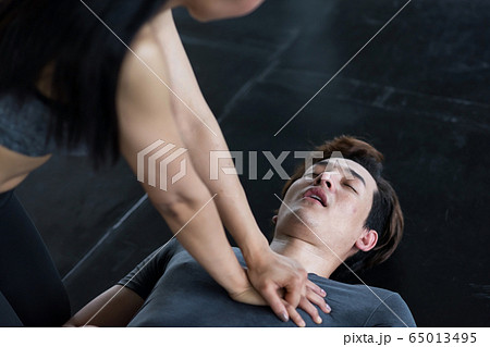 CPR or pump heart to young man in gym CPR or pump heart to young man in gym 65013495