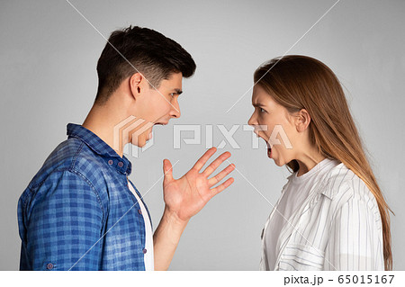 Millennial boyfriend and girlfriend swear and scream. Millennial boyfriend and girlfriend swear and scream. 65015167