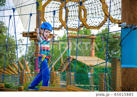 happy boy on the zip line. proud of his courage happy boy on the zip line. proud of his courage 65015885