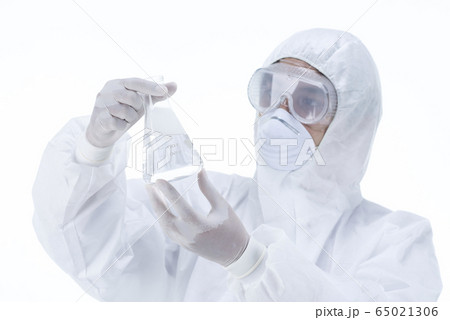 Chemist in laboratory checking test tubes. Chemist in laboratory checking test tubes. 65021306