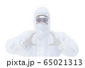 Doctor with protective clothing presenting blank palm of her hand 65021313