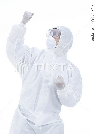 Scientists in protective clothing wearing celebrating  65021317