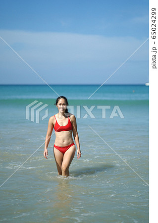 Asian Chinese Woman in various yoga poses at the 65024299