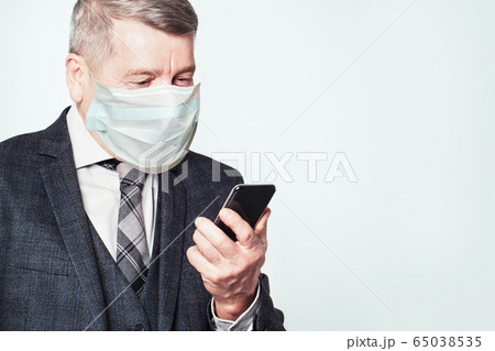 Senior man using smartphoneon white background Senior man using smartphoneon white background 65038535
