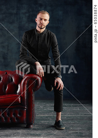 Male teenager, modern businessman in casual clothes, a new wave in business. Not a standard business, individual entrepreneur, strat ap. Copy space. 65038874