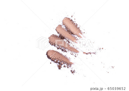 Deep brown crumbled eye shadow isolated on white background.Splatter make up and cosmetic products. Deep brown crumbled eye shadow isolated on white background.Splatter make up and cosmetic products. 65039652