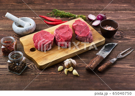 Marinated raw beef steak with spice on wooden 65040750