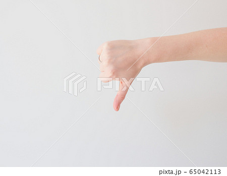 thumb down mock up on white background with ext space. minimal concept, negative thinking. Bad result, disappointment 65042113