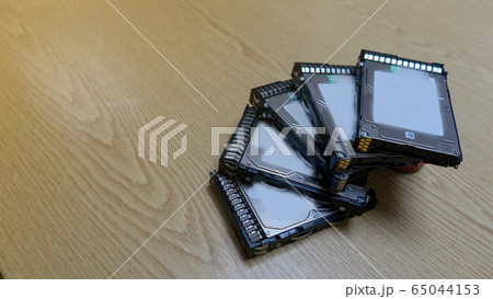 Top view server harddisk old on brown wooden table. Top view server harddisk old on brown wooden table. 65044153