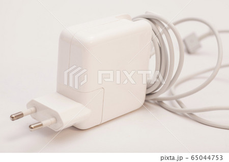 Electrical adapter to USB port on a white Electrical adapter to USB port on a white 65044753