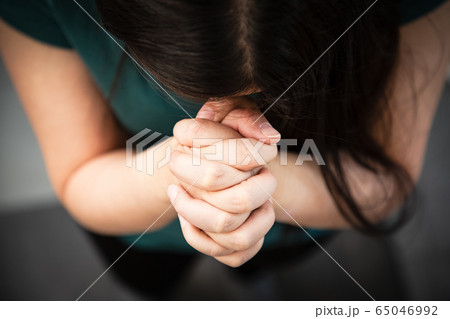 Woman's hand praying and worship to GOD 65046992