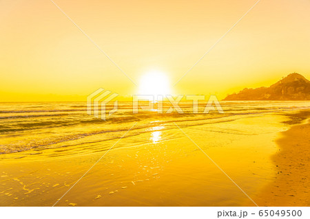 Beautiful tropical beach sea ocean with sunset or sunrise for travel vacation Beautiful tropical beach sea ocean with sunset or sunrise for travel vacation 65049500