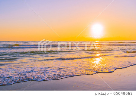Beautiful tropical beach sea ocean with sunset or sunrise for travel vacation Beautiful tropical beach sea ocean with sunset or sunrise for travel vacation 65049665