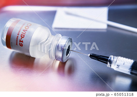 Covid-19 coronavirus vaccine on medical tray 65051318