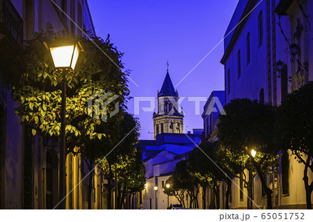 Spain, Andalusia, Seville, Old town street at dusk 65051752