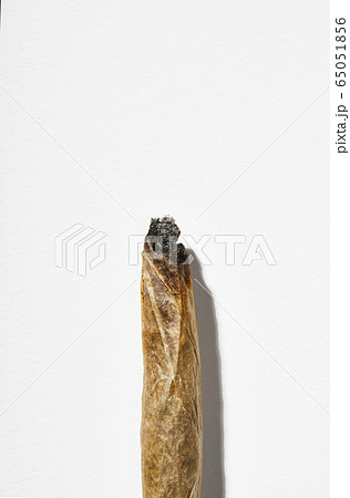 Cannabis cigarette on white background 65051856