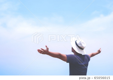 Man rise hands up to sky freedom concept with blue Man rise hands up to sky freedom concept with blue 65056015