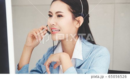 Customer support agent or call center with headset 65056526