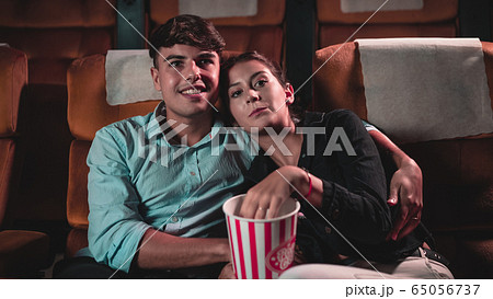 People audience watching movie in cinema theater. People audience watching movie in cinema theater. 65056737
