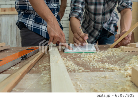 Carpenter working on wood craft at workshop Carpenter working on wood craft at workshop 65057905