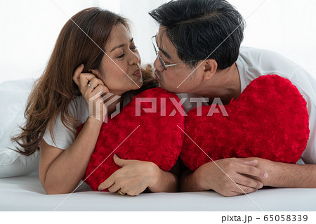 Happy Asian senior people having good time at home 65058339