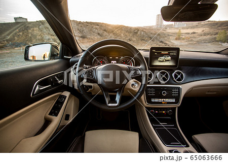 Interior of a car, beige leather seats Interior of a car, beige leather seats 65063666