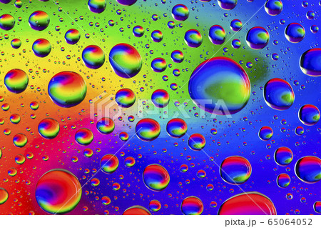 Abstract colorful background with multicolor drops of water on glass. 65064052